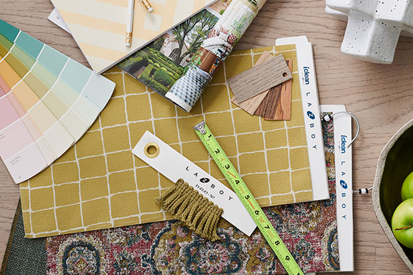 Design tools like fabric swatches, ruler, and papers 